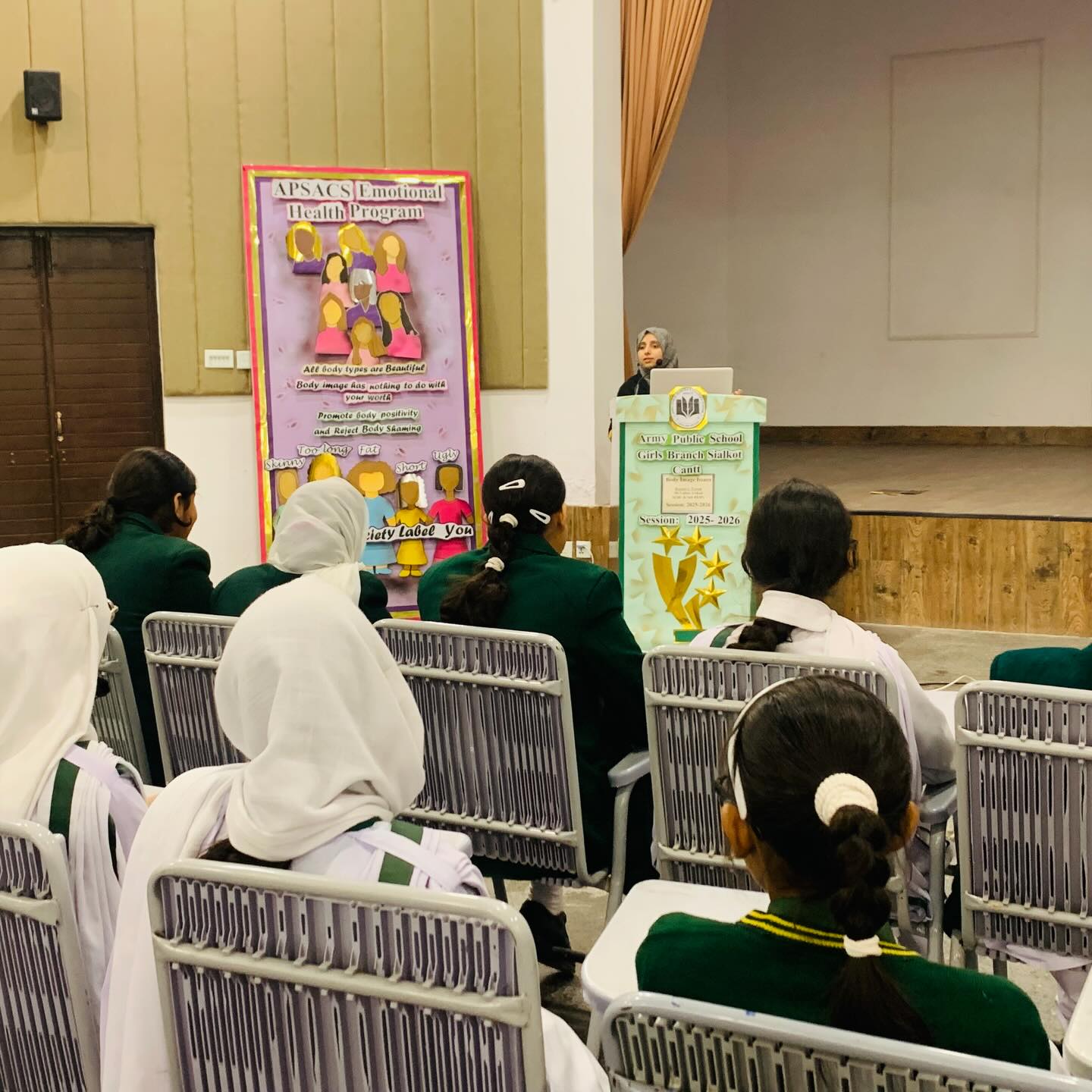 Students performing on a stage